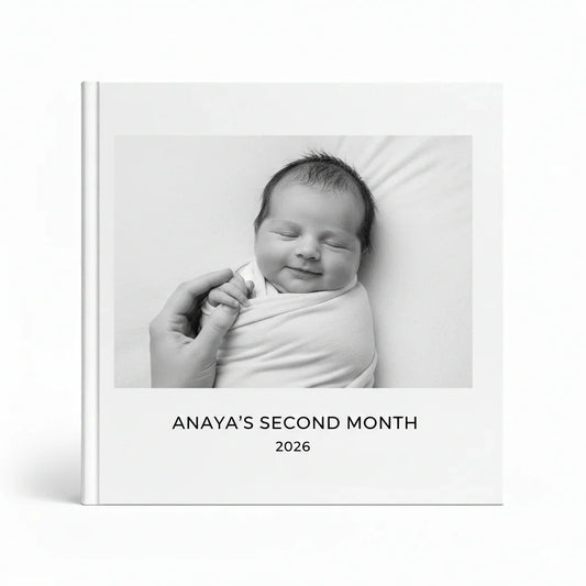 Personalized baby photo book cover with black and white image of smiling newborn, White Pebble