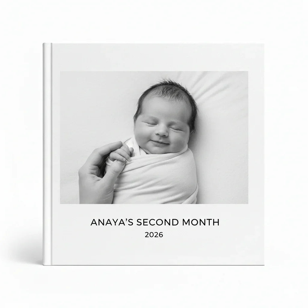 Personalized baby photo book cover with black and white image of smiling newborn, White Pebble
