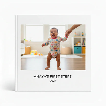 Custom baby photobook cover featuring a smiling baby taking first steps, White Pebble keepsake album.