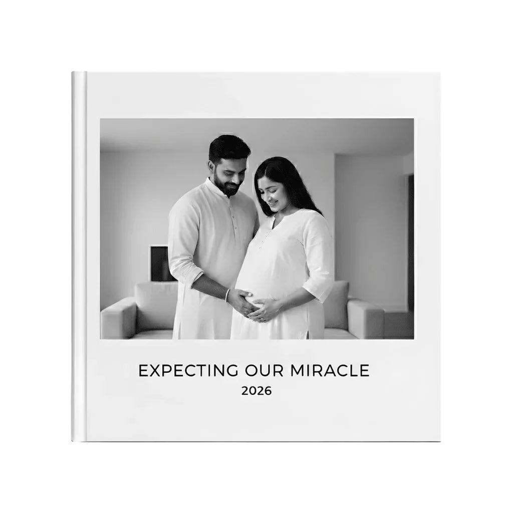 White Pebble photo book cover with expecting parents, 'Expecting Our Miracle 2026' text